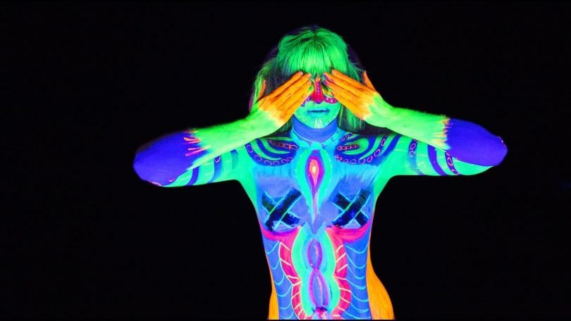 Get glowing in the dark with using the best neon body paint ideas